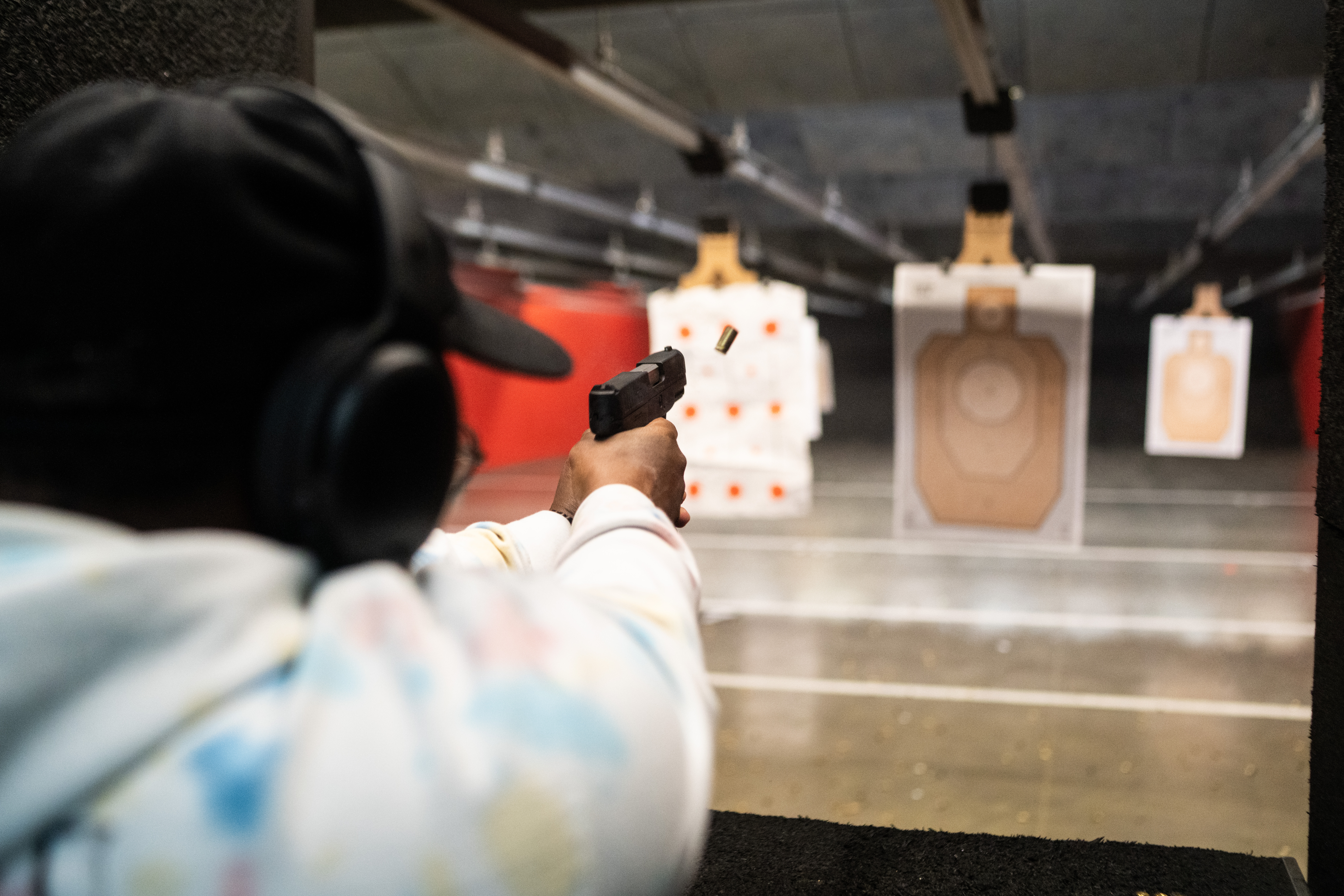 Xian Brooks practices target shooting at an indoor gun range in Louisville, Kentucky.