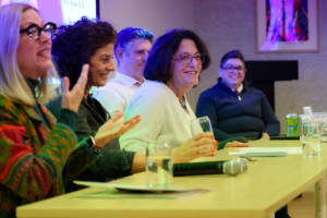 Panelists including State Rep. Lisa Willner, policy experts Jackie McGranahan and Cara Stewart, Sen. Karen Berg, and Fairness Campaign Executive Director Chris Hartman smile and engage during Queer Kentucky’s Queer Politics in the Bluegrass panel event.