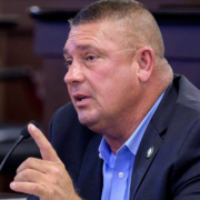 Kentucky Rep. Bill Wesley speaks into a microphone during a legislative meeting at the Kentucky State Capitol in Frankfort.