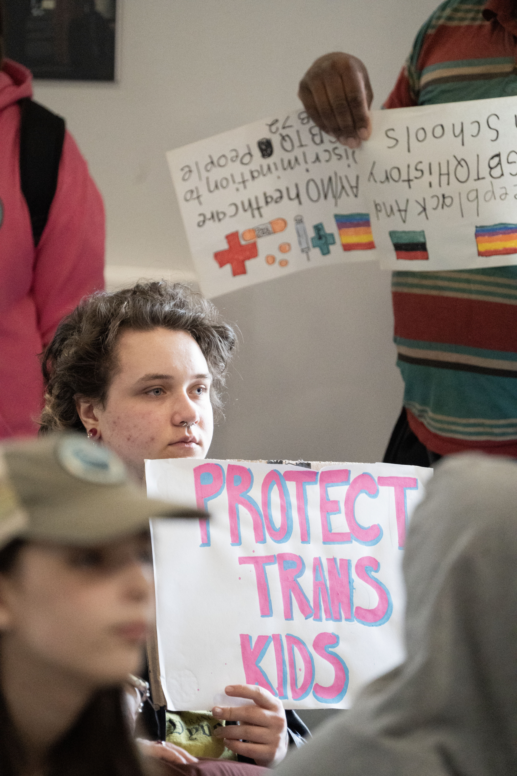 A person holds a Protect Trans Youth sign at the 2026 Fairness Rally in Kentucky.
