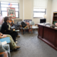 Advocates meet with a Kentucky lawmaker in his Frankfort office during the 2026 legislative session. A photographer documents the visit, which included a Martin Luther King Jr. tribute display and a "We Can Do It!" poster on the wall.