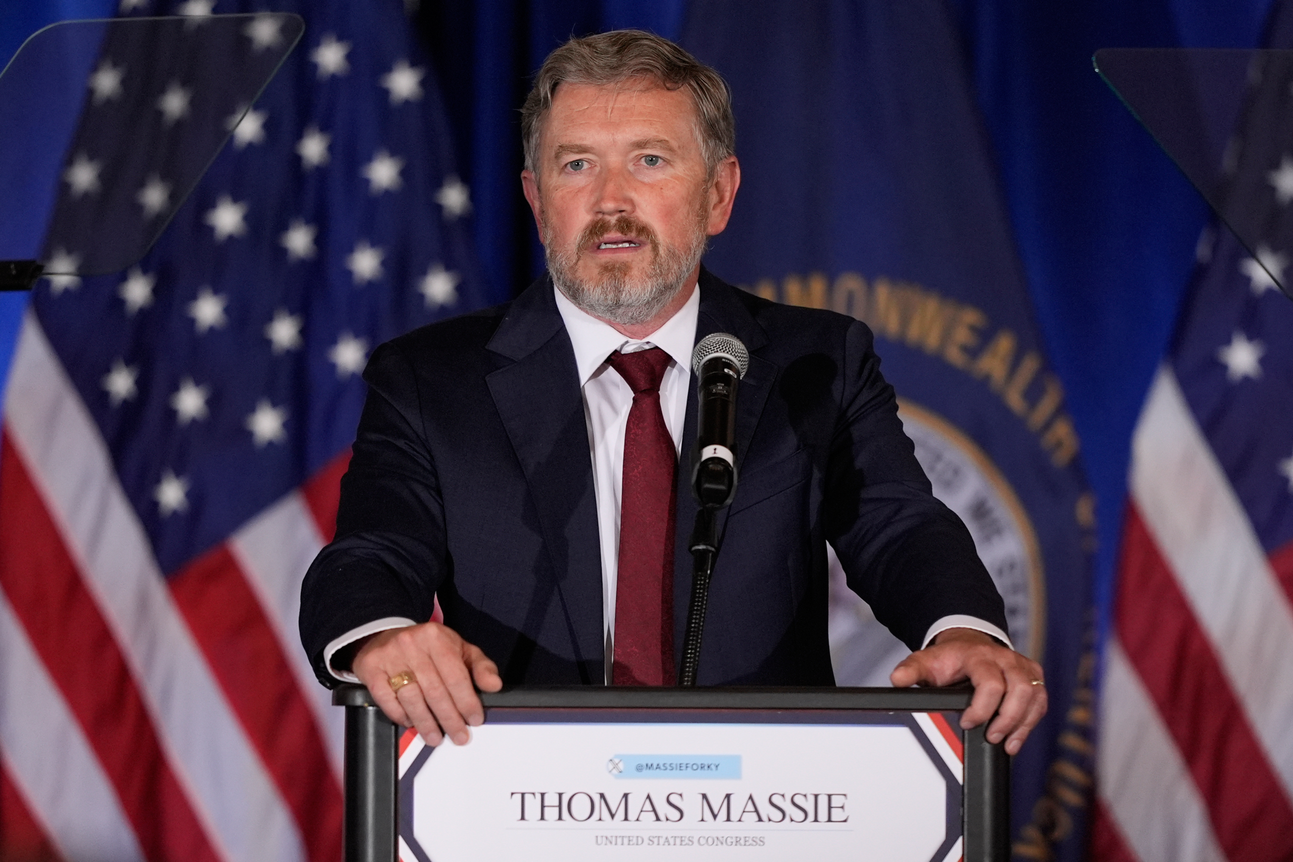 Rep. Thomas Massie speaks at a podium during a congressional event
