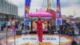 A young performer in red sings on the Viva Glam stage at NYC Youth Pride, part of The Future Perfect Project's programming