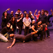 Cast of YOUR HANDS ARE THE ROAD, a musical about queer American history, posing on stage at ACT Louisville