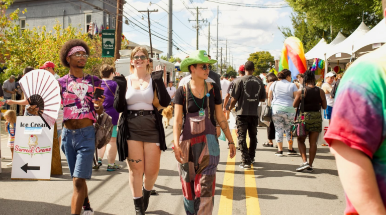 Attendees walk through the Louisville Pride Festival
